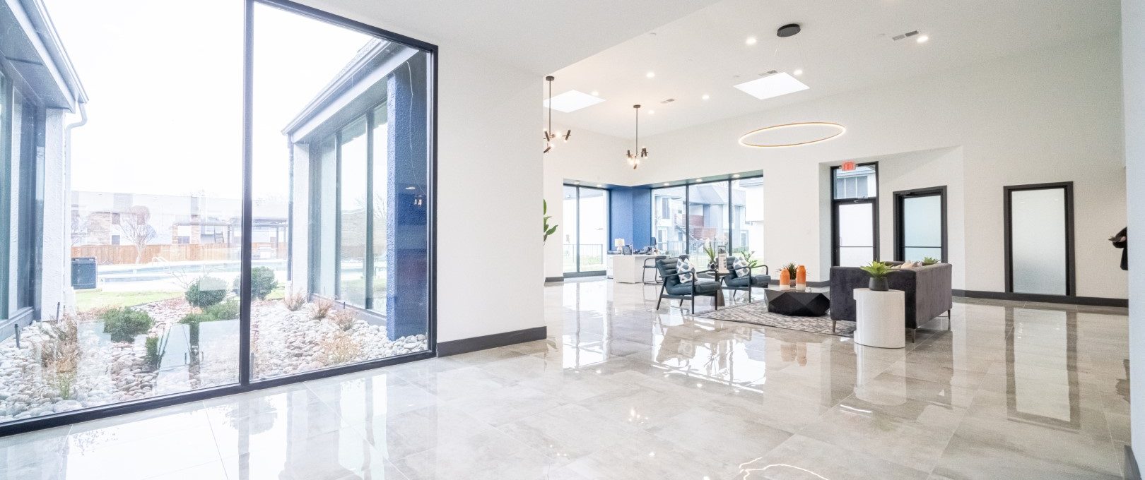 a large open floor plan with glass doors at The Hendrix Apartments