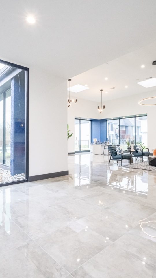 a large open floor plan with glass doors at The Hendrix Apartments